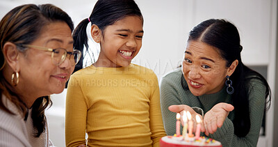 Buy stock photo Child, family and celebration with birthday cake in home, smile and special day with generations. Mother, grandmother and girl with candles at party, dessert or milestone with happiness in house