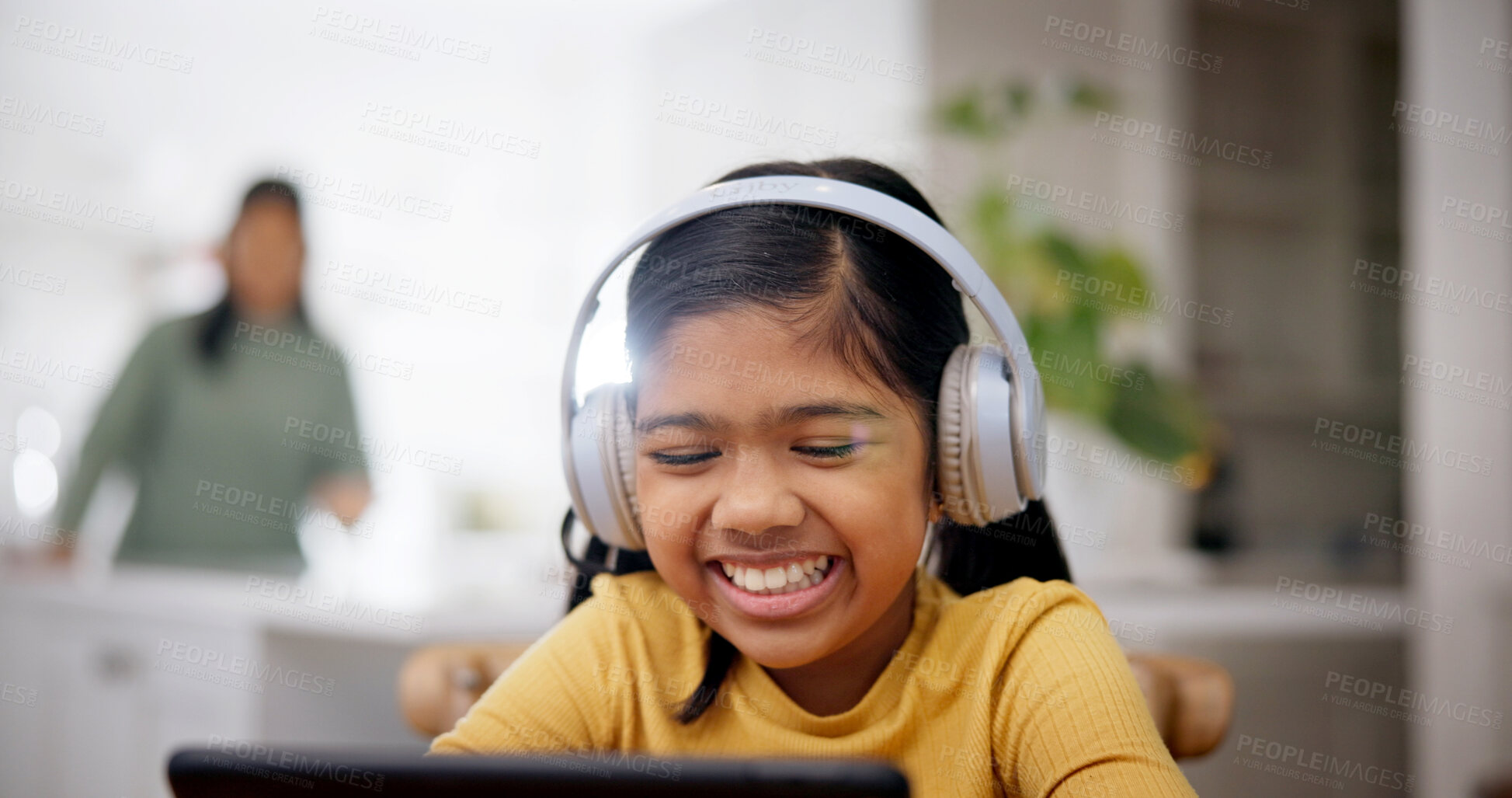 Buy stock photo Headphones, reading and child with tablet in home, online education and watch live stream of class. Laugh, elearning and happy girl with tech for academic development, funny video and joke for lesson