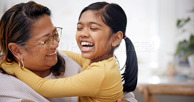 Buy stock photo Laughing, grandmother and child with hug in home for support, affection and security for weekend visit. Happy, senior woman and girl with embrace for connection, relationship development and bonding