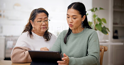 Buy stock photo Teaching, woman and senior mother with tablet in house, homepage setup or system review for bonding. Tech education, learn or Asian people with advice for digital literacy, app navigation or guidance