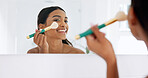 Happy, woman and makeup brush in bathroom with mirror, morning routine or powder application for beauty. Person, cosmetic tools and apply foundation in home with reflection, smile and getting ready.