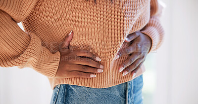 Buy stock photo Hands, pain and woman at house with stomach, discomfort and symptoms of menstruation. Sore, female person and cramps in home with abdomen ache, constipation and inflammation for chronic endometriosis