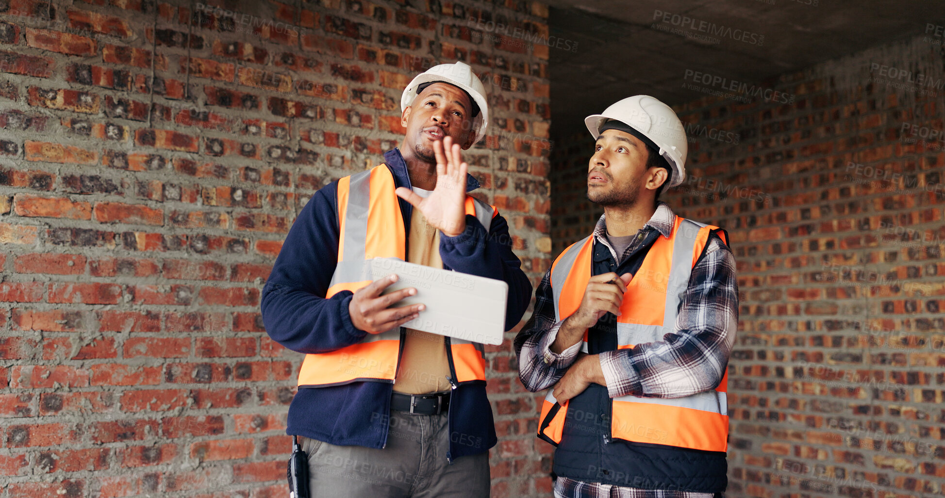 Buy stock photo Engineer, inspection and people at construction site with tablet, discussion or check building safety. Space, engineering team and talk with tech for quality assurance, project and collaboration.