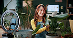 Gardening, influencer and woman in home with ring light, phone and recording video for plant growth. Happy person, live stream and content creation with horticulture advice, tutorial or social media.