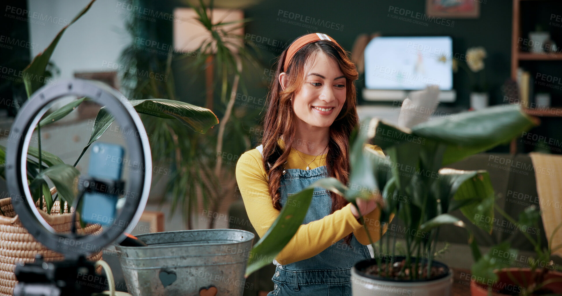 Buy stock photo Gardening, influencer and woman in home with ring light, phone and recording video for plant growth. Happy person, live stream and content creation with horticulture advice, tutorial or social media.