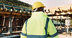 Construction, thinking and back of man outdoor for inspection, planning or building project. Architecture, engineer and African person with idea for property development, renovation or infrastructure