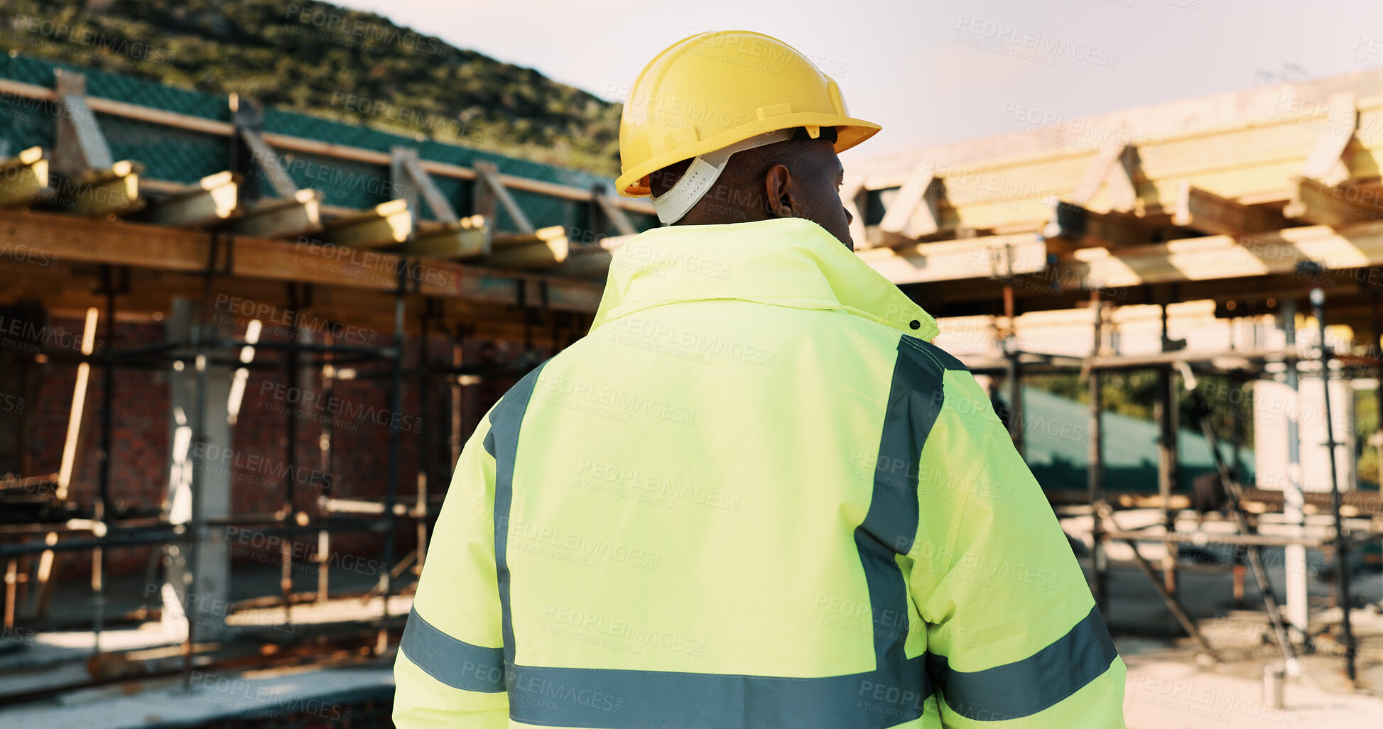 Buy stock photo Construction, thinking and back of man outdoor for inspection, planning or building project. Architecture, engineer and person with idea for property development, renovation or infrastructure