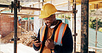 Fist pump, black man and construction worker with phone on site for bonus, win or infrastructure approval. Excited, cellphone and African male civil engineer with positive review on home renovation.