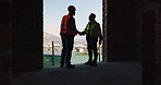 Team, handshake and men in construction site, achievement and collaboration for architecture project. Civil engineering, shaking hands and people with gesture for agreement in building and shadow