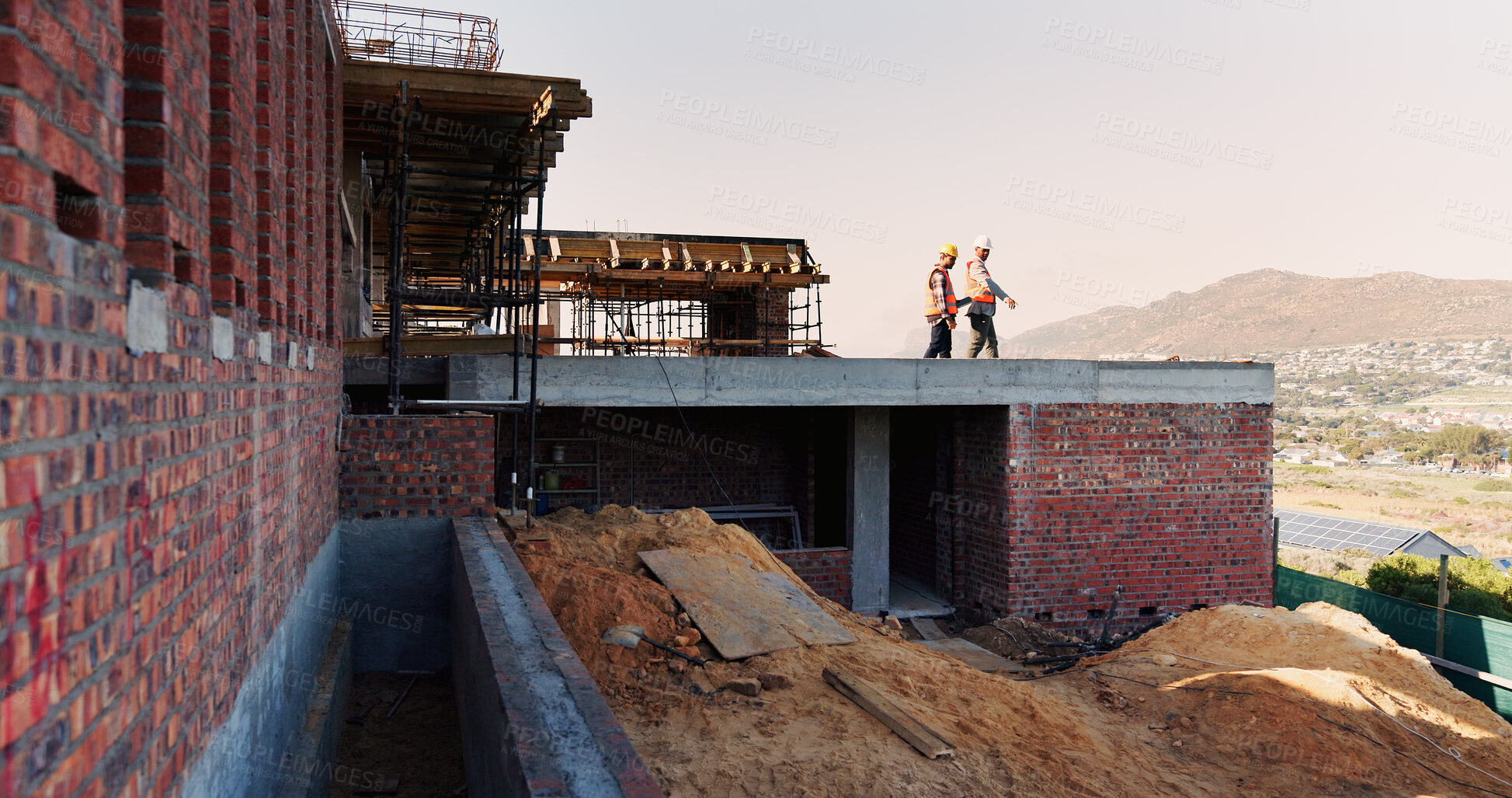 Buy stock photo Civil engineering, teamwork and men with ideas on roof, construction site and inspection for project. Architect, point and people with plans for architecture, talking and collaboration at building