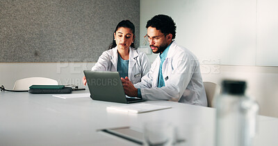 Buy stock photo Doctors, team and laptop with review at hospital in boardroom, meeting and planning for healthcare. People, medical professional and insight with computer, feedback or services at wellness clinic