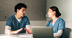 Meeting, laptop and nurses in hospital for planning with diagnosis, research or treatment plan. People, discussion and team of healthcare workers with computer for online medical service in clinic.