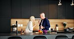 Smile, couple and cooking in home with singing, celebration and playful for meal prep. Happy, mature people and karaoke at house with utensils, listening to music and anniversary for romantic lunch
