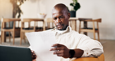 Buy stock photo Man, paperwork and remote work in home with laptop, problem solving and review tax administration. Freelancer, black person and reading in living room with document, computer or revenue service info.