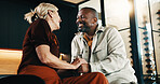 Holding hands, love and smile with interracial couple in home living room for bonding or security. Affection, happy and relax with mature people on sofa in apartment for support, trust or wellness