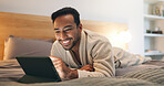 Reading, online and man with tablet on bed, entertainment and relax with app subscription in bedroom. Digital, ebook and happy person with technology, internet connection and novel download in house