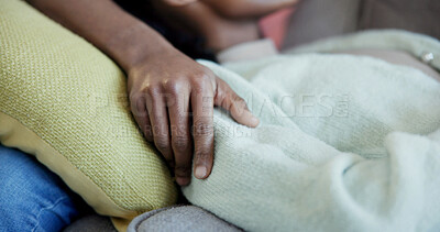 Buy stock photo Couple, support and relax on couch, home and connection with partner on break or affection in lounge. People, hand and bonding on weekend, comfortable and commitment for relationship in house