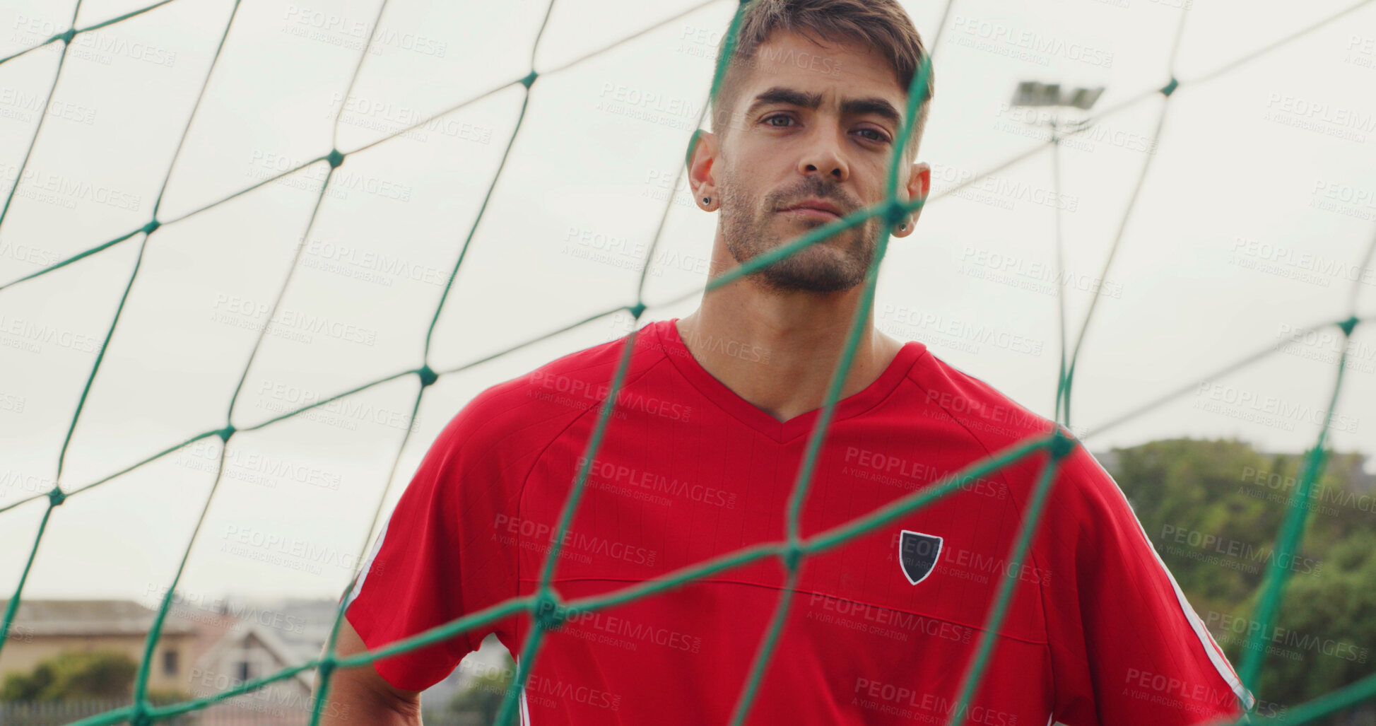 Buy stock photo Net, fitness and portrait of soccer player on field for game, match or training for scholarship. Sport, serious man athlete and confidence for college football, exercise or practice skill outdoor
