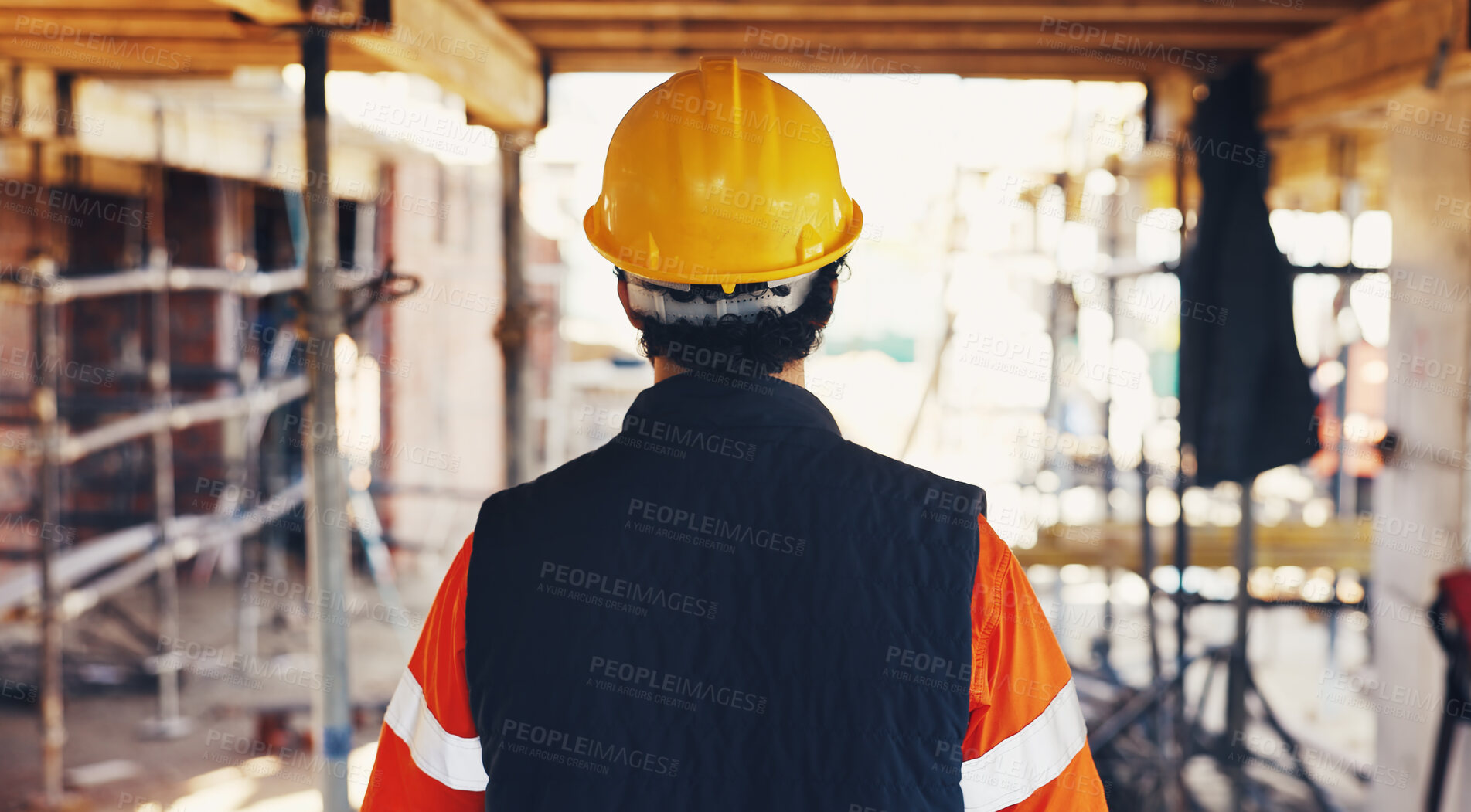 Buy stock photo Man, back and walking for construction site, inspection and contractor compliance with helmet. Safety manager, maintenance and quality assurance for renovation, engineering or project management
