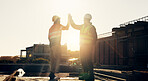 Engineer, handshake and men at construction site for welcome, support or agreement on building plan. B2B, contractor and people with partnership, architecture progress and collaboration for process