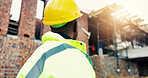 Construction, thinking or man outdoor with plan, progress reflection or mindset in building evaluation. Industrial, review or engineer with back, project insight or operation perspective on site.