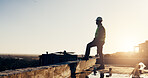 Architect, inspection and man with helmet, construction and plan for property development and space. Outdoor, safety check and black person on rooftop, architecture and decision for building project