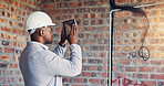 Photography, engineer and man with tablet in building, property inspection and infrastructure review. Back, site evaluation and person with tech for renovation plan, space or electrical line picture
