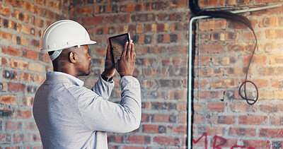 Buy stock photo Photography, engineer and man with tablet in building, property inspection and infrastructure review. Back, site evaluation and person with check for renovation plan, tech or electrical line picture