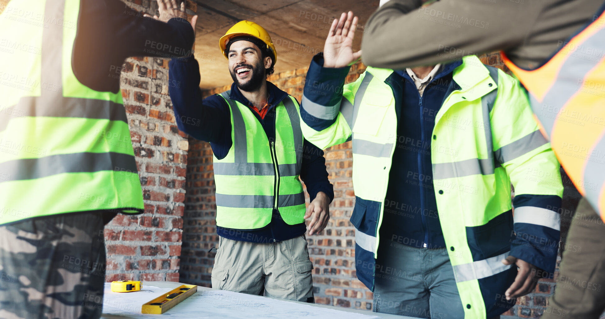 Buy stock photo Engineer, team and high five at construction site with blueprint, celebration and talk for building design. Architect, men and floor plan with partnership, success and infrastructure layout approval