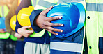 Construction, hands and group in row with helmet for labor safety, site inspection or policy meeting. Line, people and waiting with hard hat for team briefing, workplace compliance or maintenance ppe