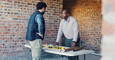 Buy stock photo Engineer, architect and meeting with team in discussion, update and planning at construction site. Men, serious collaboration and project or floor plan for renovation, expansion or building process