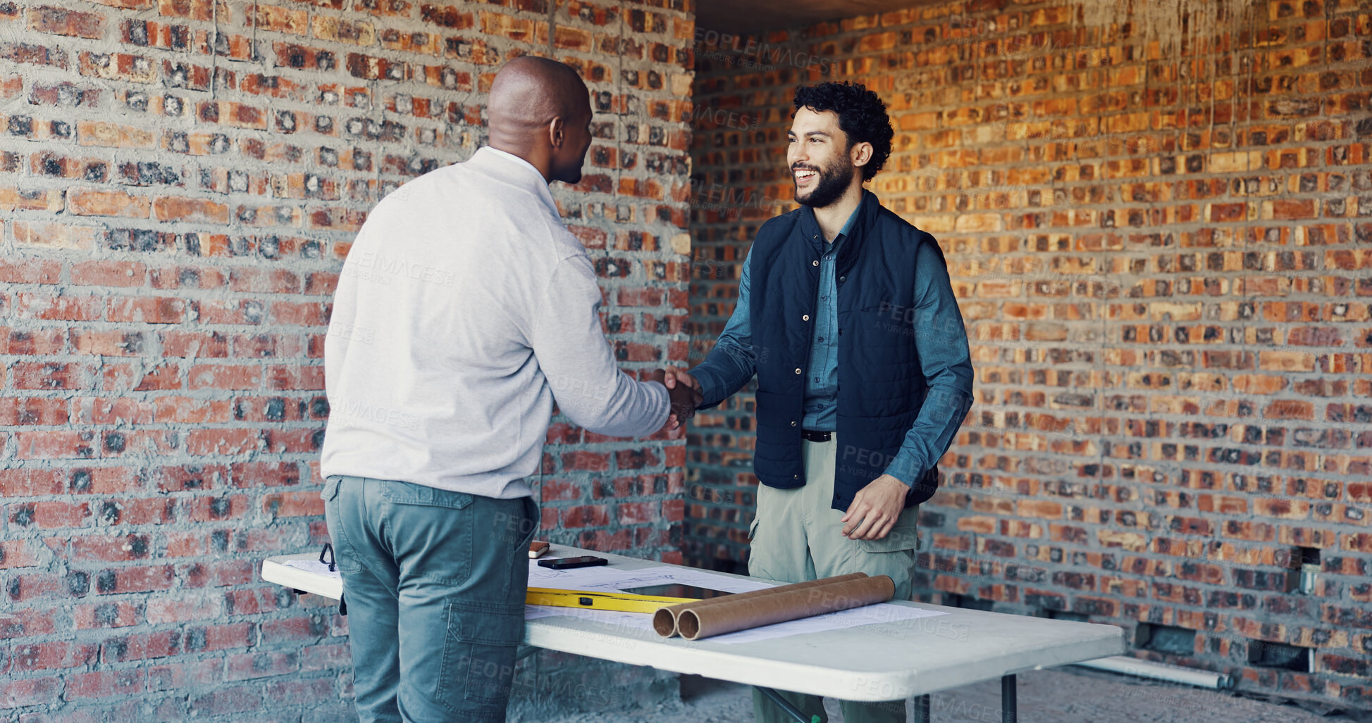 Buy stock photo Engineer, architect and shaking hands with partner in agreement deal or planning at construction site. Happy men, collaboration or handshake for project with onboarding, expansion or building success