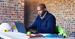 Typing, architect and black man with laptop for construction project, building or property expansion. Engineer, computer or serious person in office for real estate development or architecture design