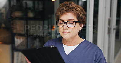 Buy stock photo Night, reading and tablet with nurse woman in hospital for healthcare, medical report or research. App, information and review with person in dark clinic for digital feedback, planning or schedule