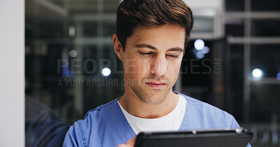 Buy stock photo Night, reading and tablet with nurse man in hospital for healthcare or medical internship as student. App, report and service with person in dark clinic for agenda, calendar or residency schedule