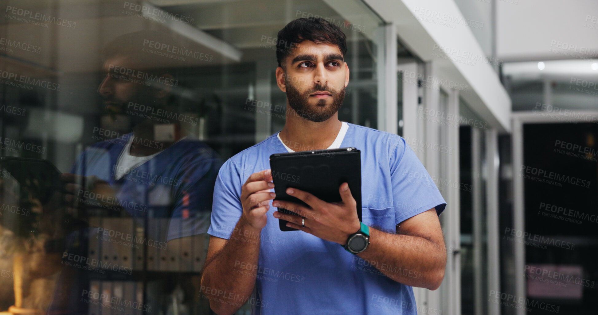 Buy stock photo Thinking, nurse and man with tablet for medical idea, research or schedule at night in hospital. Tech, worker and person in clinic for healthcare planning, problem solving and overtime by glass