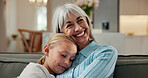 Trust, grandmother and child on sofa with hug, bonding together and support in childcare. Smile, family and grandchild in house with embrace, security and happy connection in loving relationship.