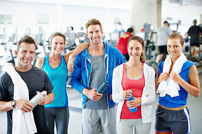 Buy stock photo Portrait of young men and women standing together in a gym
