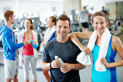 Buy stock photo Portrait of a young man and woman standing together at the gym