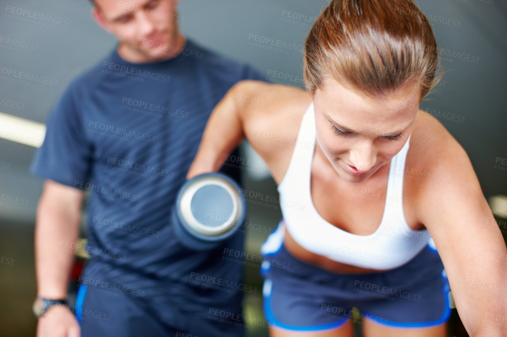 Buy stock photo Dumbbell, personal trainer and support with people in gym for fitness, weightlifting and workout partner. Coaching, exercise  and help with man and woman in sports center for weights and bodybuilder