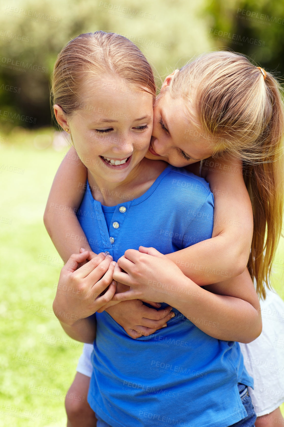 Buy stock photo Happy, children and sisters in backyard with hug, connection and love for bonding together on weekend. Girls, embrace and siblings outdoor with family wellness, childhood memories and friendship.
