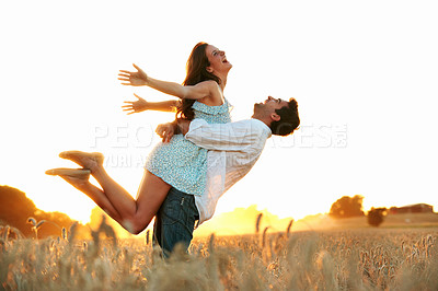 Buy stock photo Love, sunset or couple in countryside with fun, happy moment or bonding on outdoor break. Flare, space or people on field with carrying, romantic connection or playful relationship on summer evening.