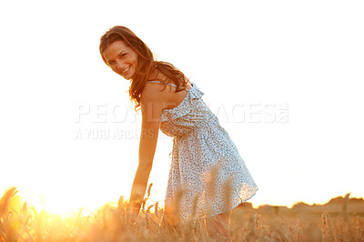 Buy stock photo Travel, wheat and portrait with woman in field for explore, adventure getaway and sunset in countryside. Happy, wellness and peace with person in nature for tourism, vacation and summer holiday