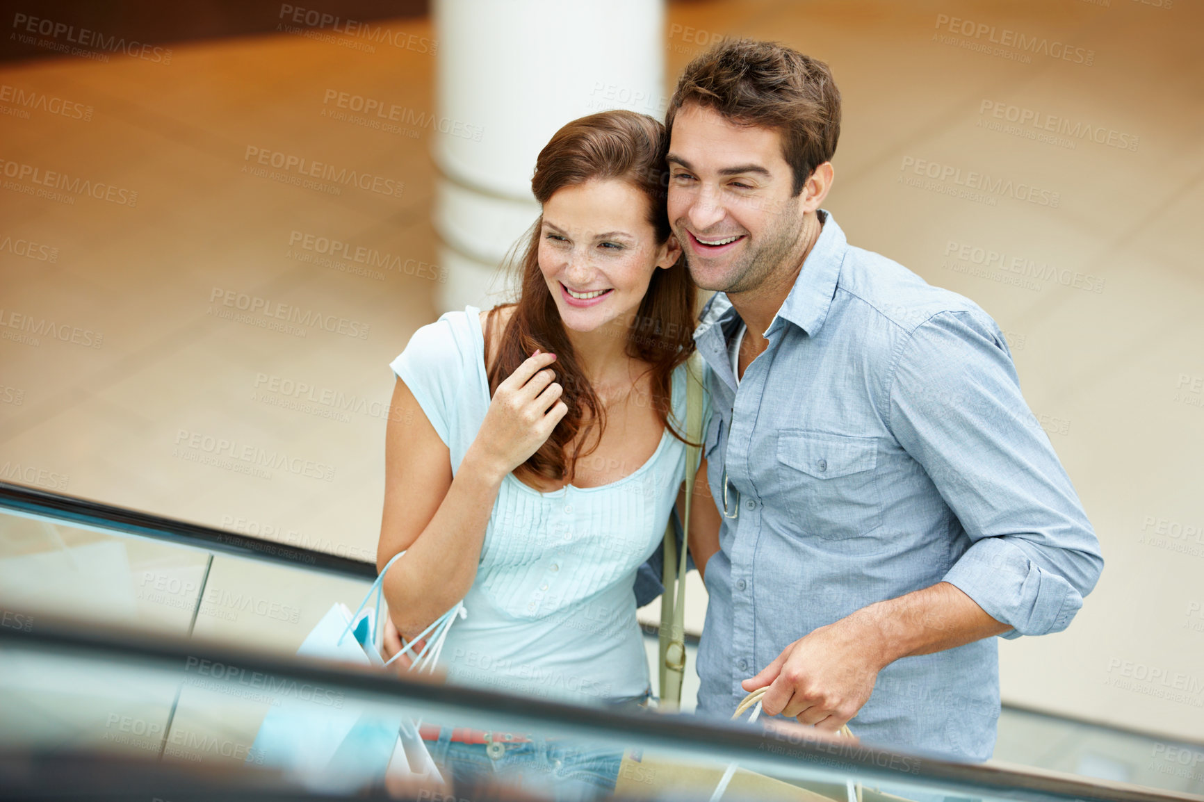 Buy stock photo Love, shopping and escalator with couple in mall for retail purchase, anniversary gift and support. Store discount, customer promotion and smile with man and woman with bags for boutique shopper