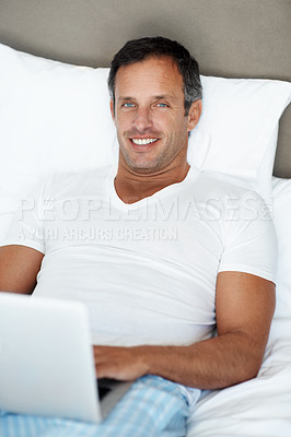 Buy stock photo Relax, man and portrait with laptop on bed for global stocks news, trading and remote work. Freelance trader, happy mature person and tech in home for market tracking, research and productive morning