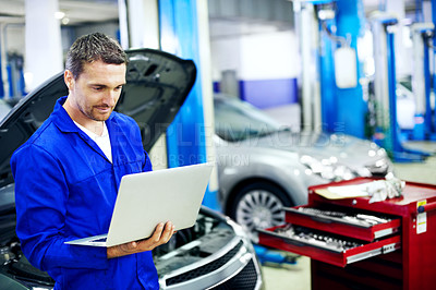 Buy stock photo Man, laptop and car mechanic in workshop with research, review cost and quote for maintenance service. Technician, person and browsing in garage with computer, fix vehicle and report repair expenses.