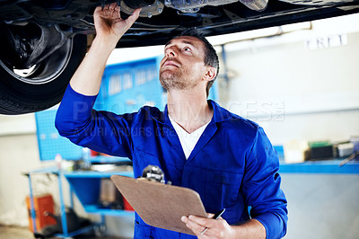 Buy stock photo Mechanic, man or car service with checklist in workshop for brake safety, calibration or compliance. Technician, mature person or clipboard for vehicle inspection, exhaust system or auto repair quote