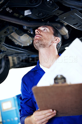 Buy stock photo Mechanic, man and car inspection with checklist in workshop for exhaust leak, damage or compliance. Vehicle, mature technician and clipboard for routine maintenance, roadworthy notes or service quote