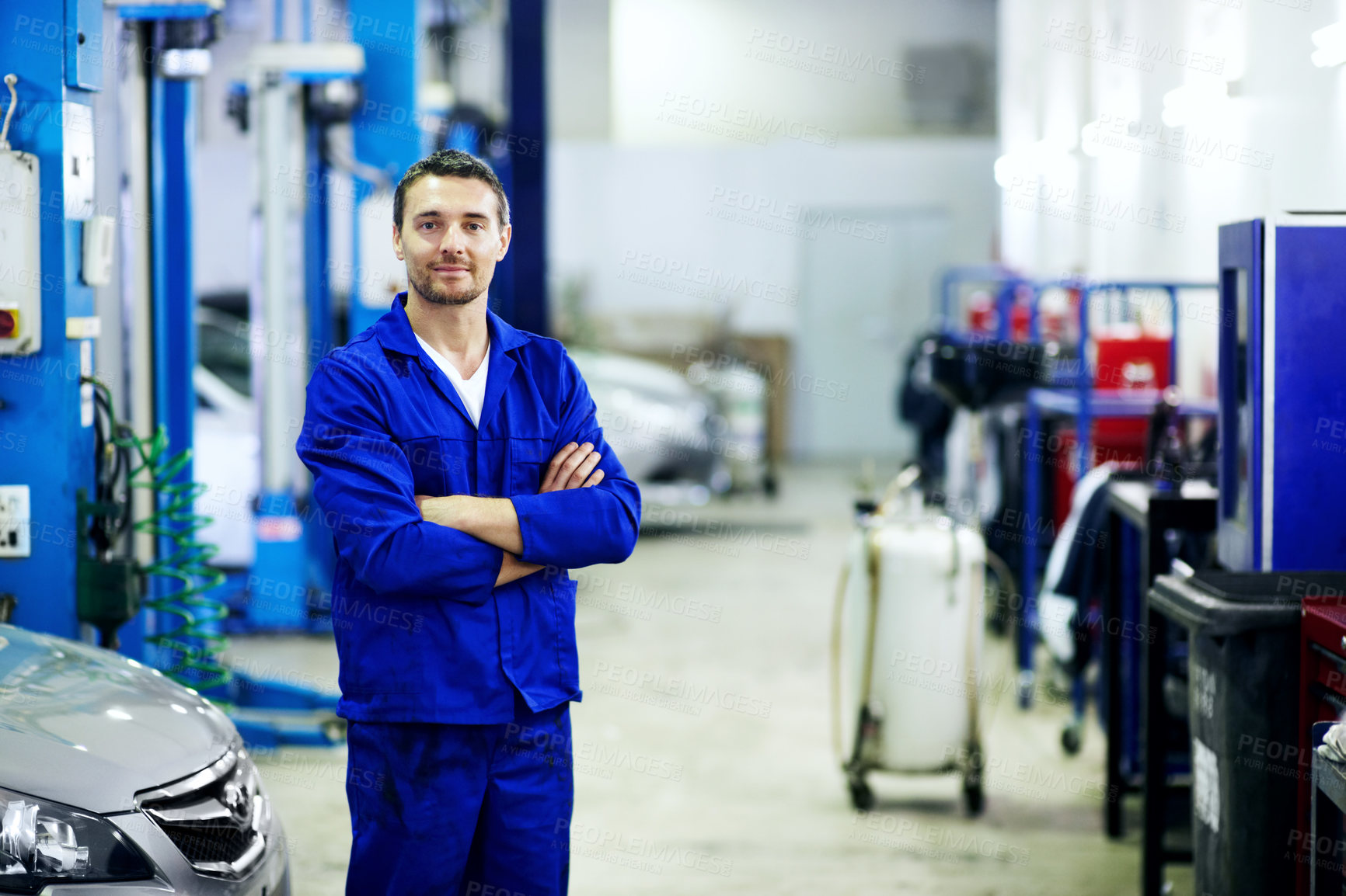 Buy stock photo Arms crossed, portrait and space with mechanic in garage for automobile maintenance or repair. Car, service and transport with engineer man in vehicle workshop for professional check or inspection