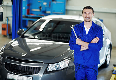 Buy stock photo Portrait, wrench or car mechanic in workshop with arms crossed, ambition or about us as repair technician. Happy, man or auto engineer with tool, confidence or career pride in vehicle maintenance.